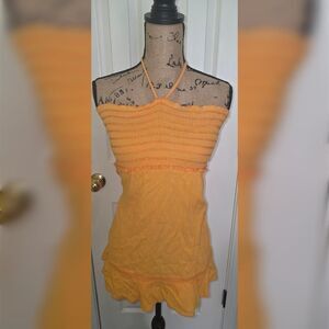 Orange halter top with ruffle hem and adjustable straps
